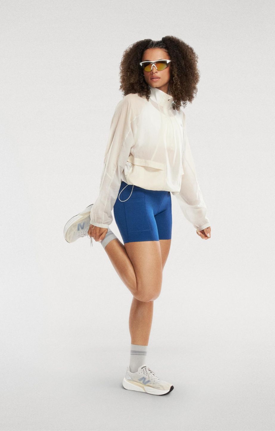 Person standing in a studio, wearing new balance fuelcell rebel v5