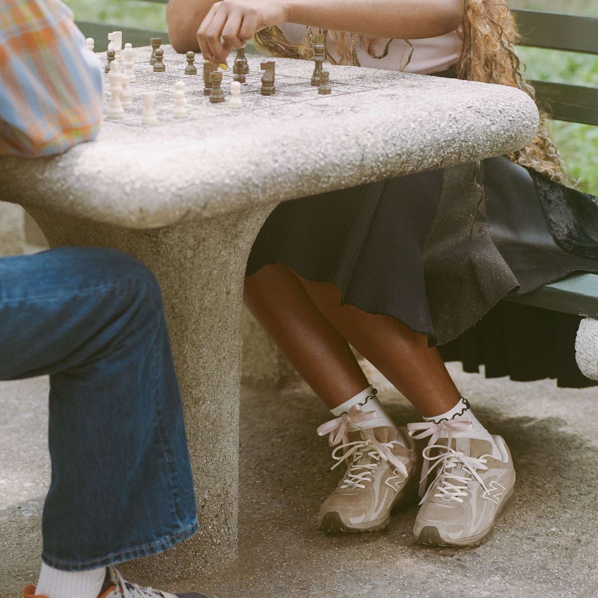 Woman playing chess and wearing the 204L