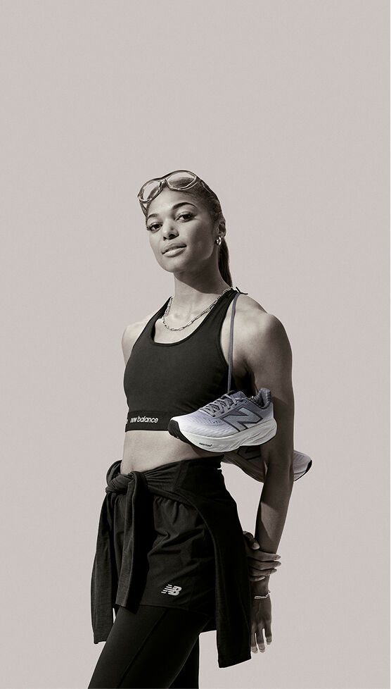 Gabby Thomas wearing the Fresh Foam X 1080 over her shoulder 