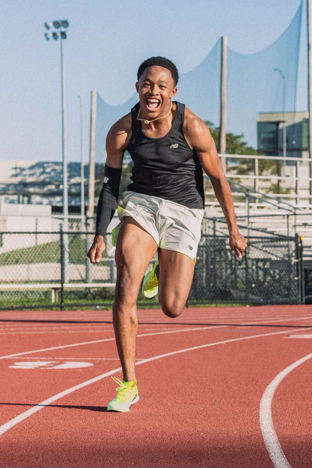 Quincy Wilson running on a track 