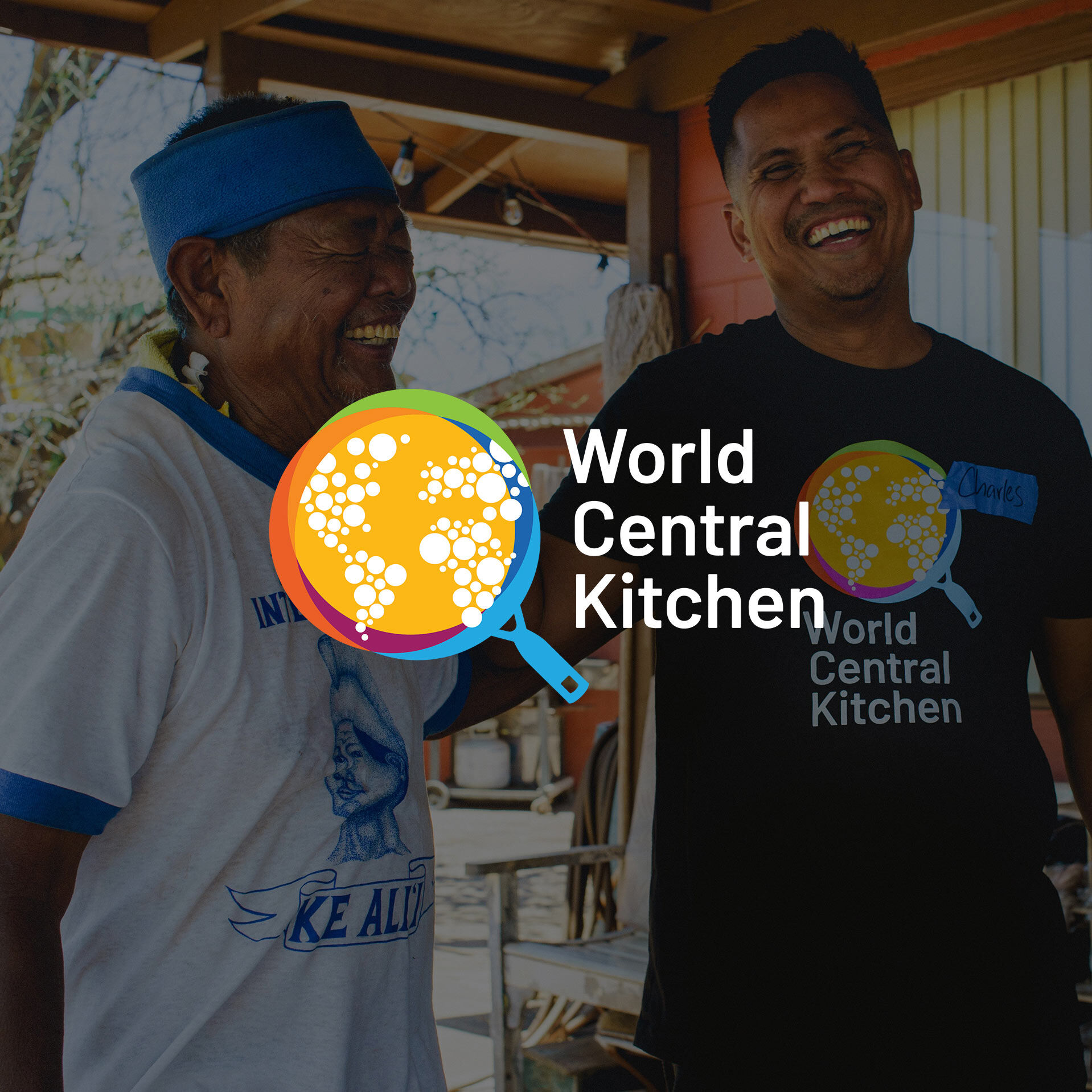 Two male-presenting adult volunteers working on behalf of World Central Kitchen during their response efforts on the island of Maui, Hawaii in the town of Lahaina after the devastating fire in August of 2023.