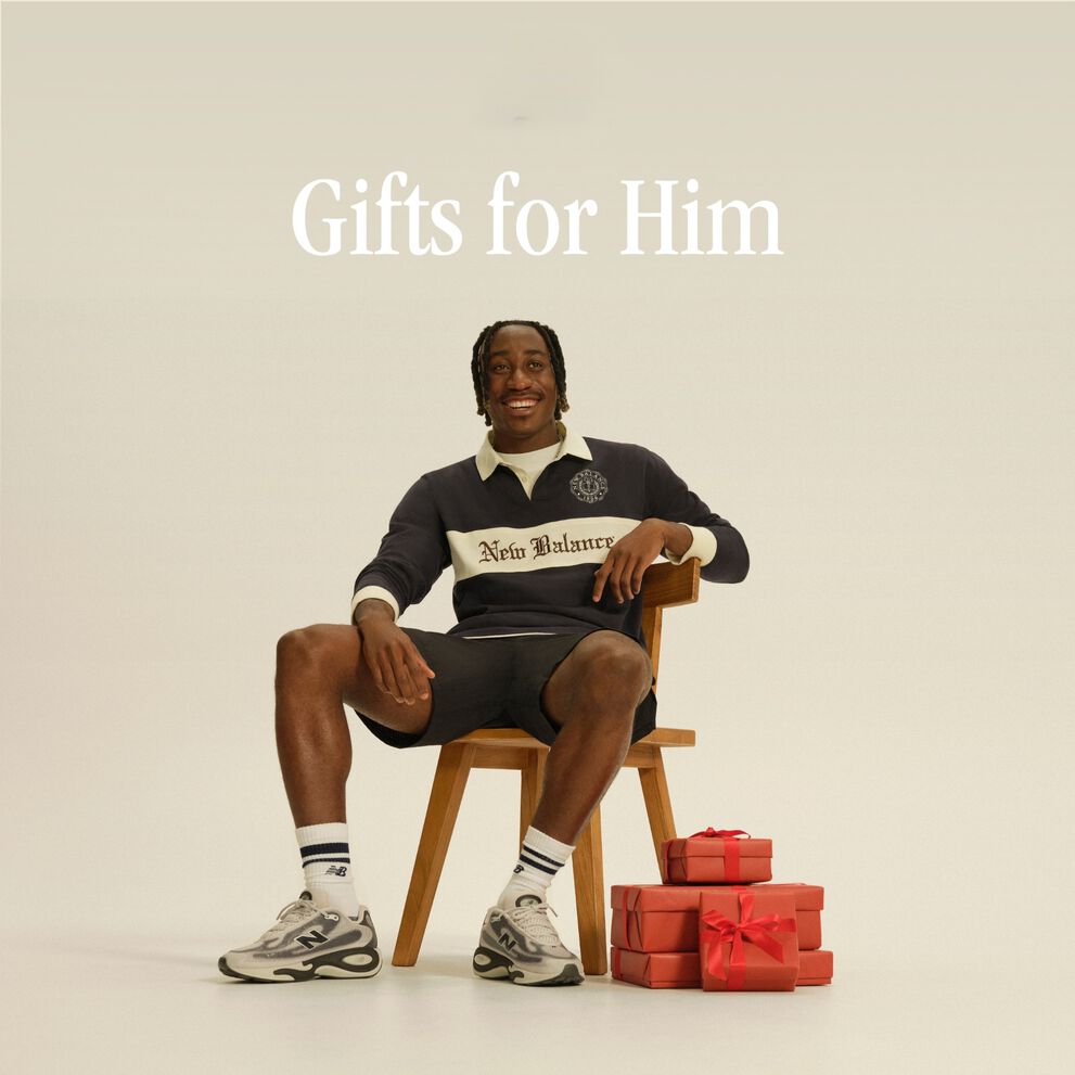 Man sitting on a chair next to gifts