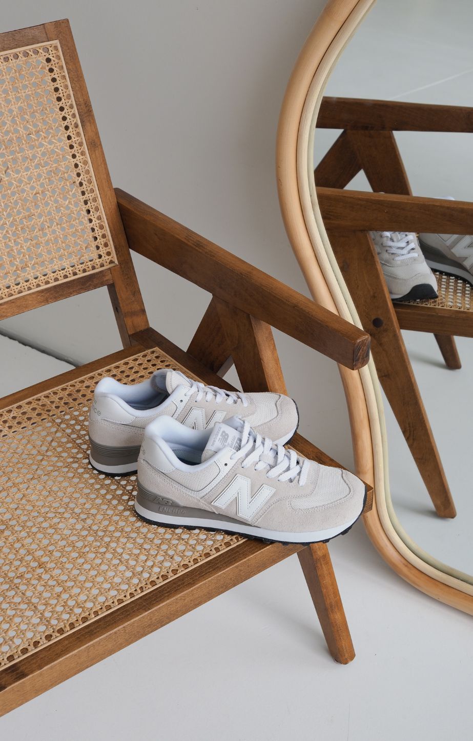 Pair of 574 sneakers sitting on chair