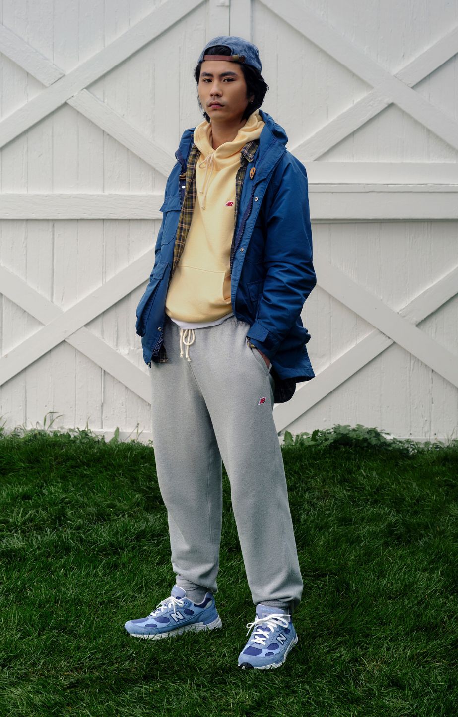 A man wearing New Balance Made in USA apparel and footwear.