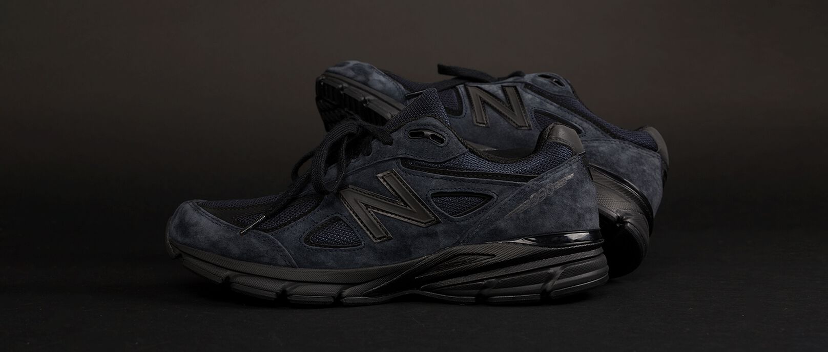 A pair of New Balance JJJJound's 990 shoes
