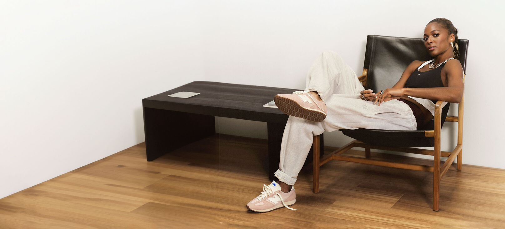 Gabby Thomas sitting in a chair.