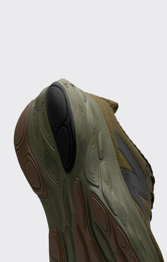 Heel detail of a green Fresh Foam X 1080 shoe. 