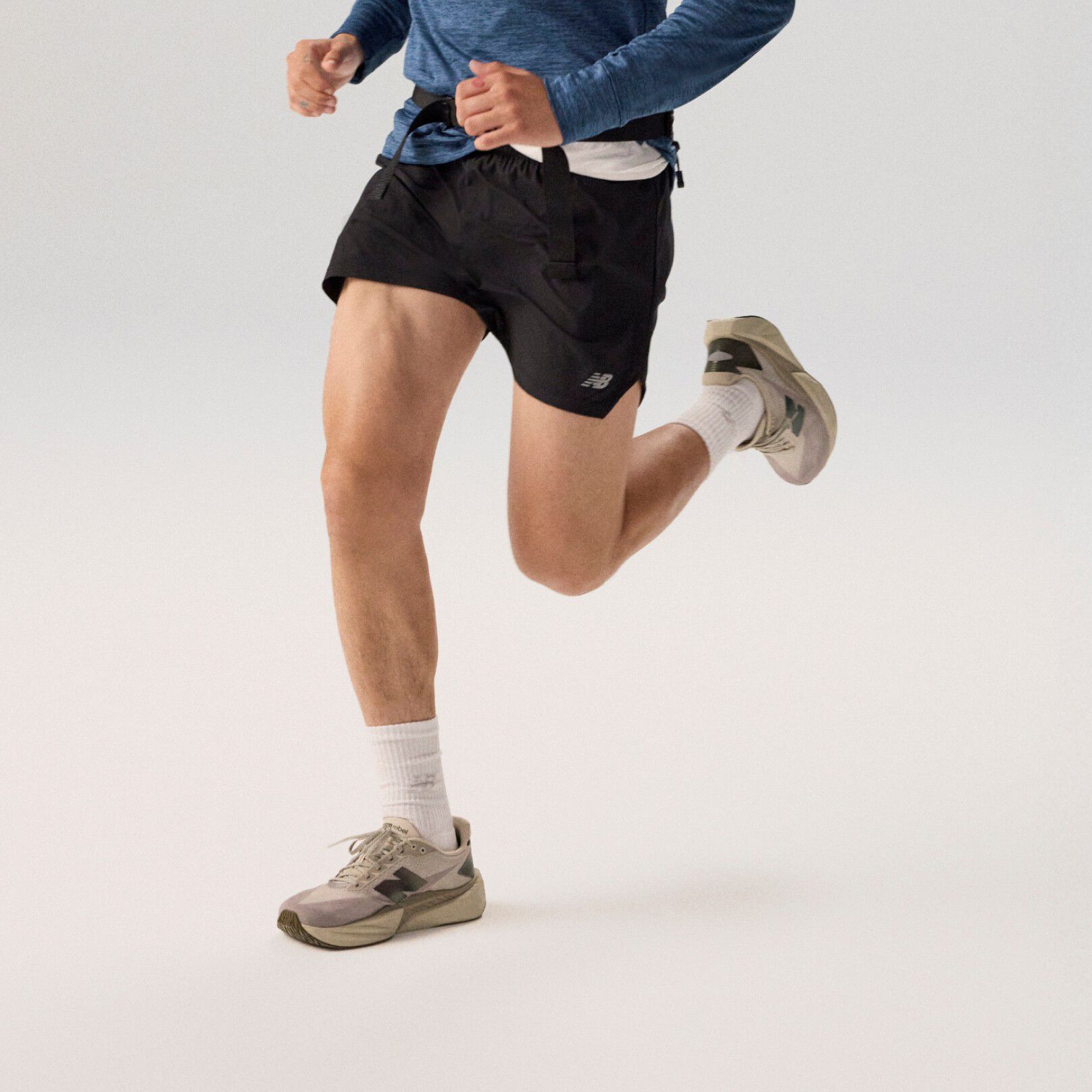 Close up of man running in FuelCell Rebel runners