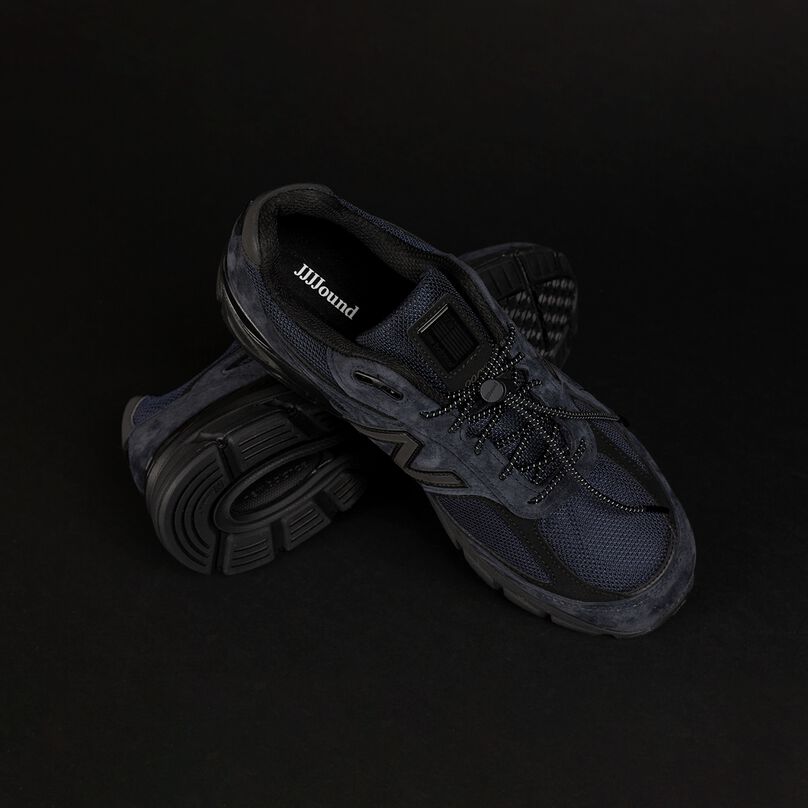 A pair of New Balance JJJJound's 990 shoes