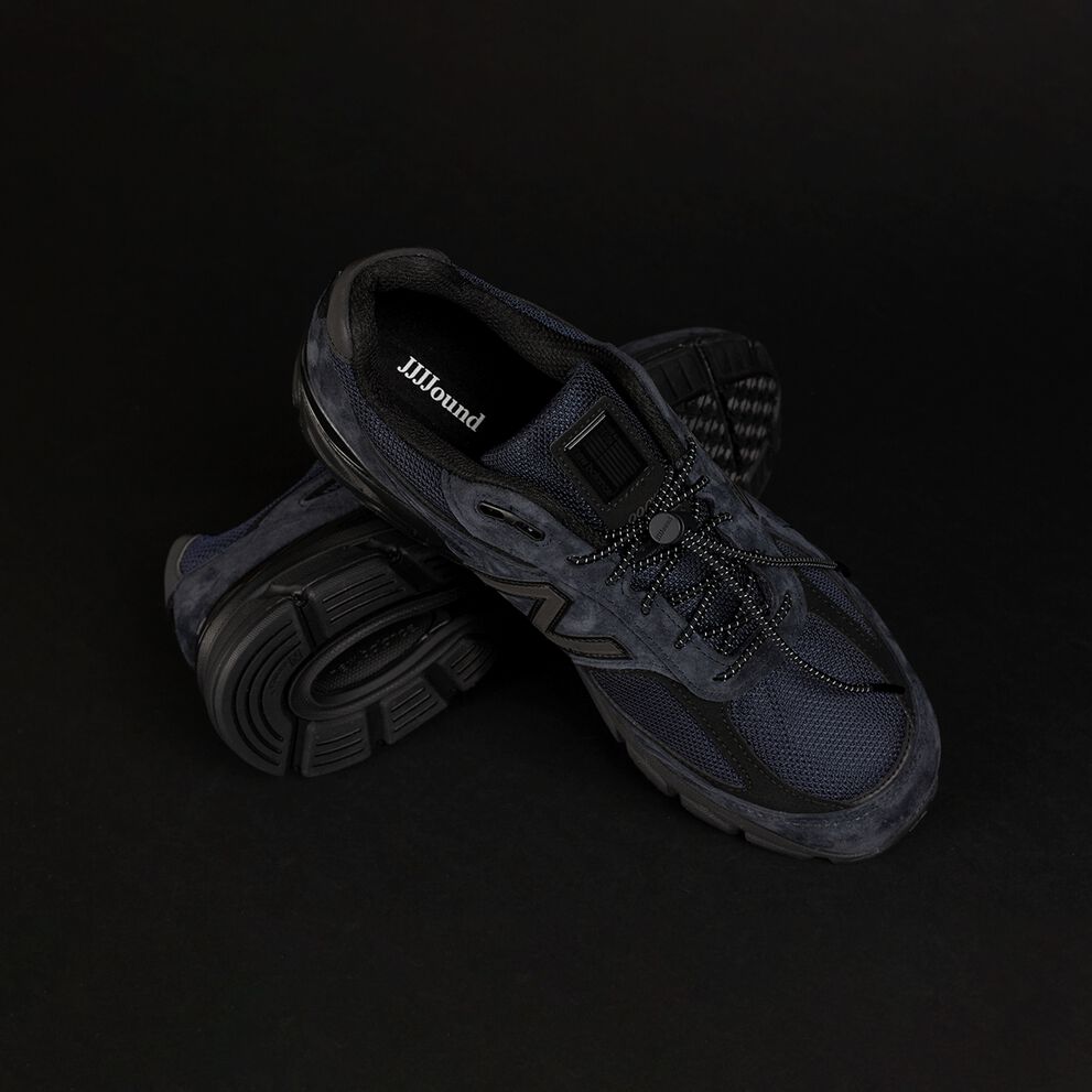 A pair of New Balance JJJJound's 990 shoes