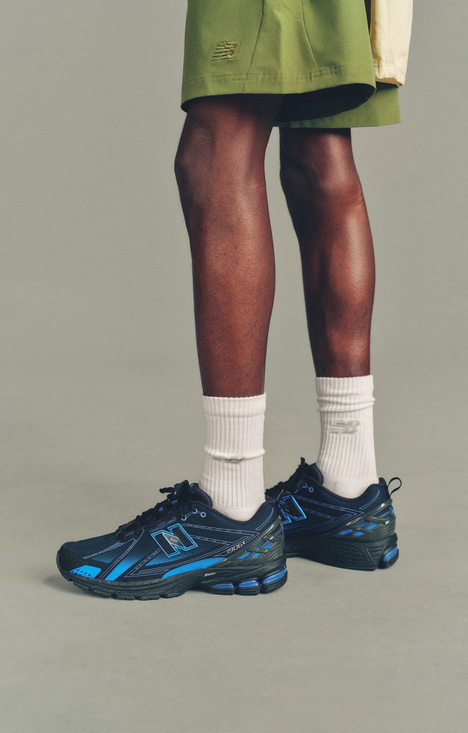 someone wearing new balance 1906 sneakers