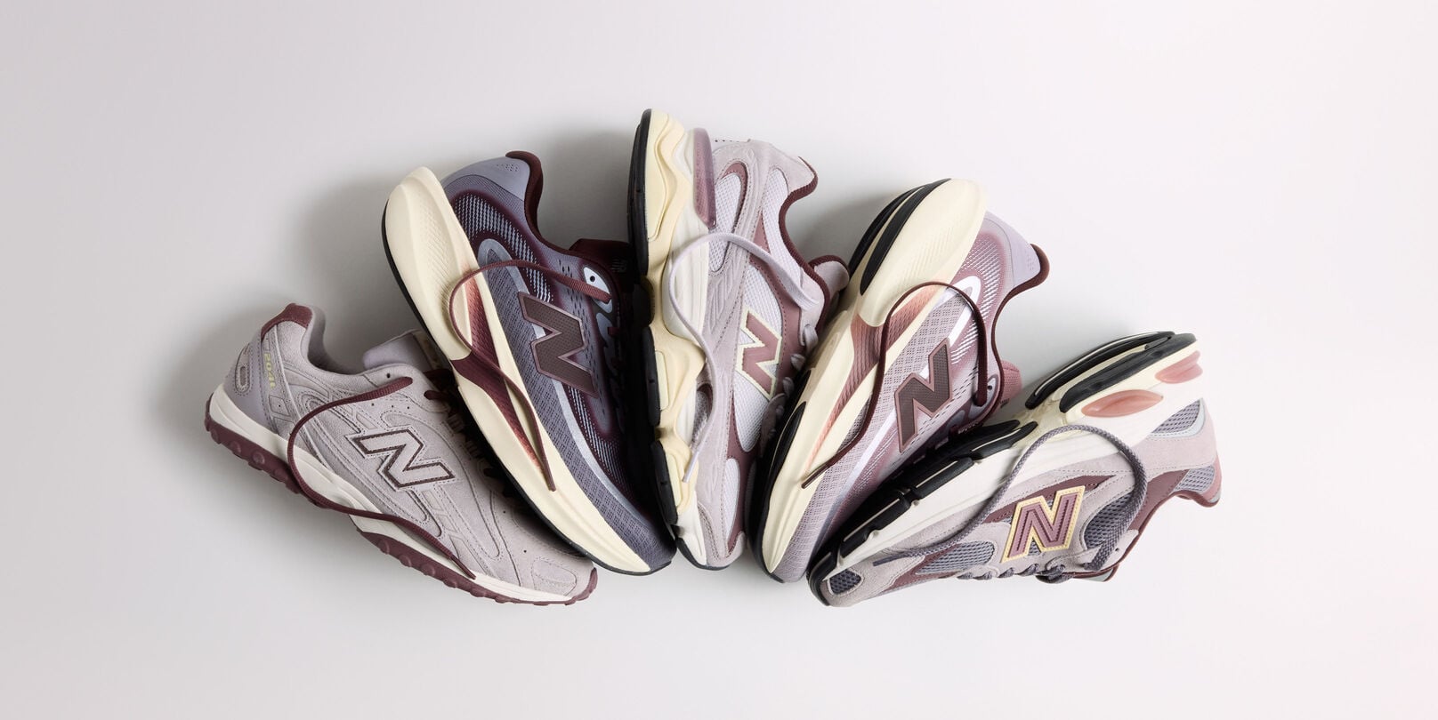 The Crimson Fog Pack laying fanned out on a grey background