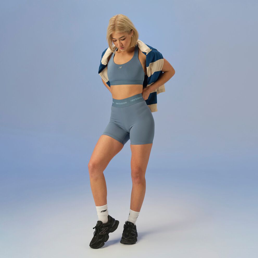 woman posing in studio wearing 9060 sneakers