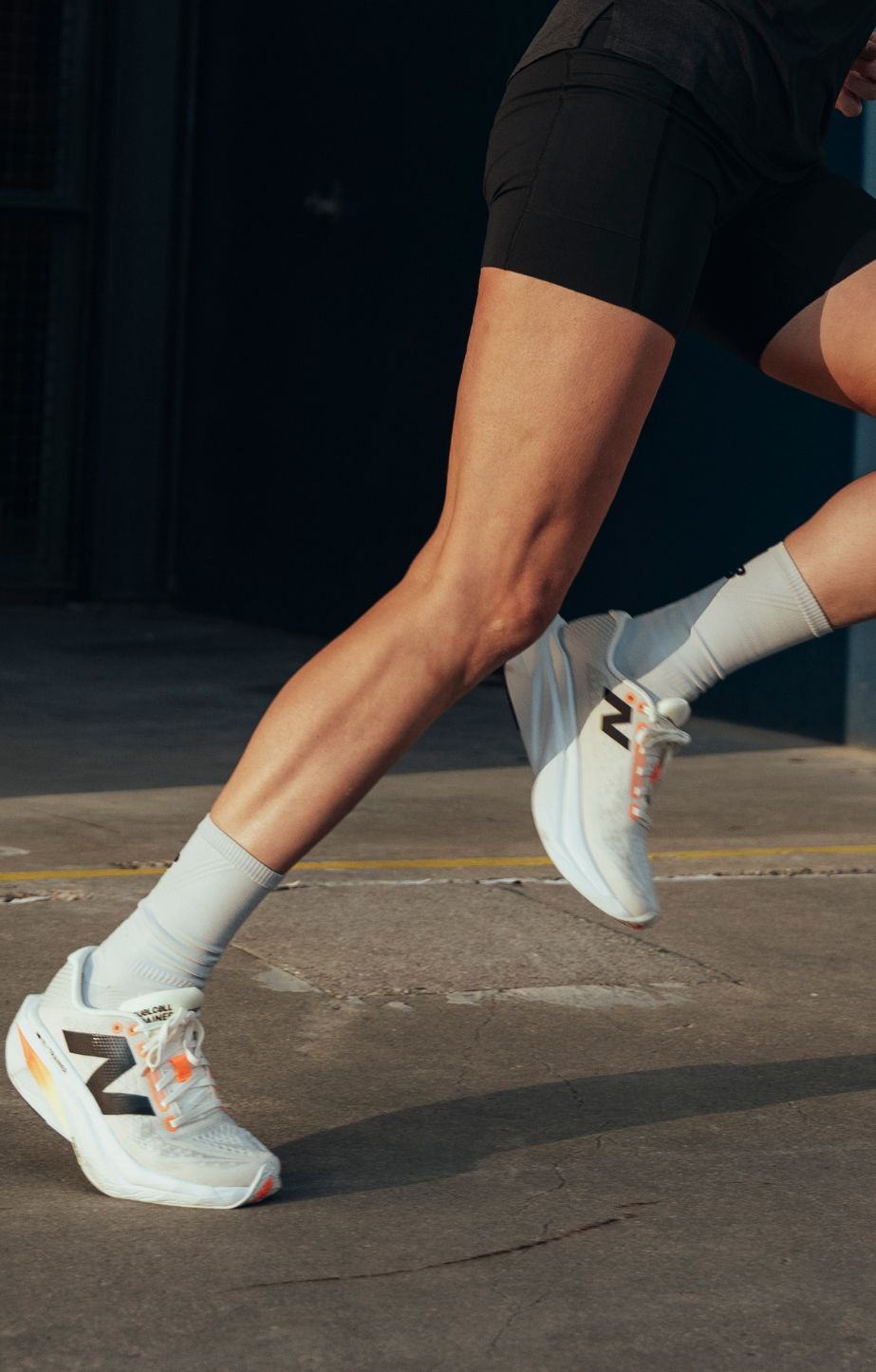 Person running and wearing new balance fuelcell supercomp trainer v3 running shoes