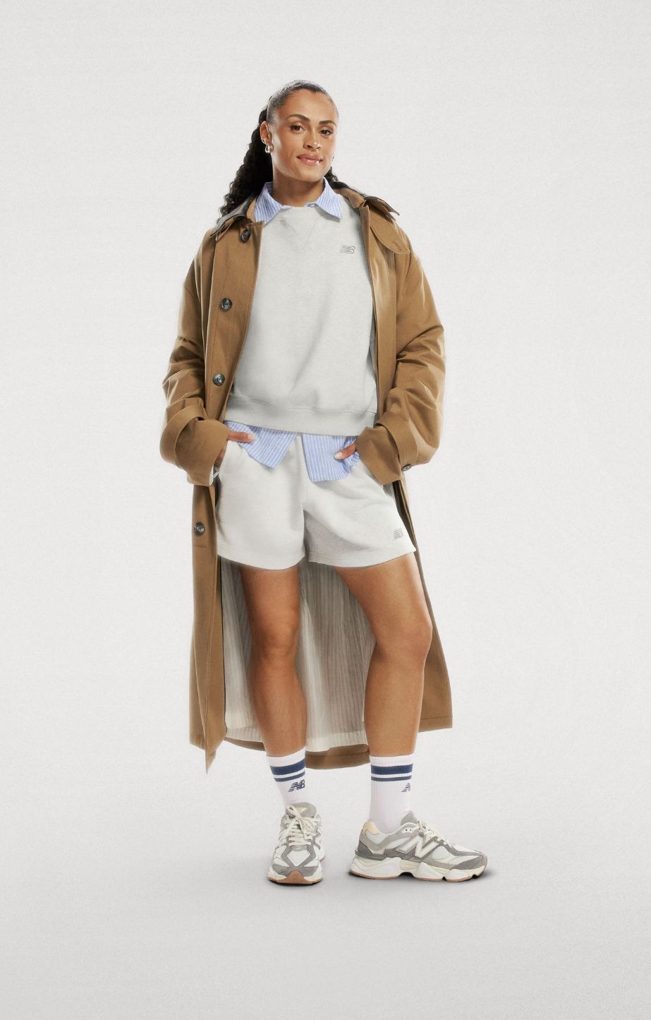 Woman standing, wearing new balance 9060 sneakers