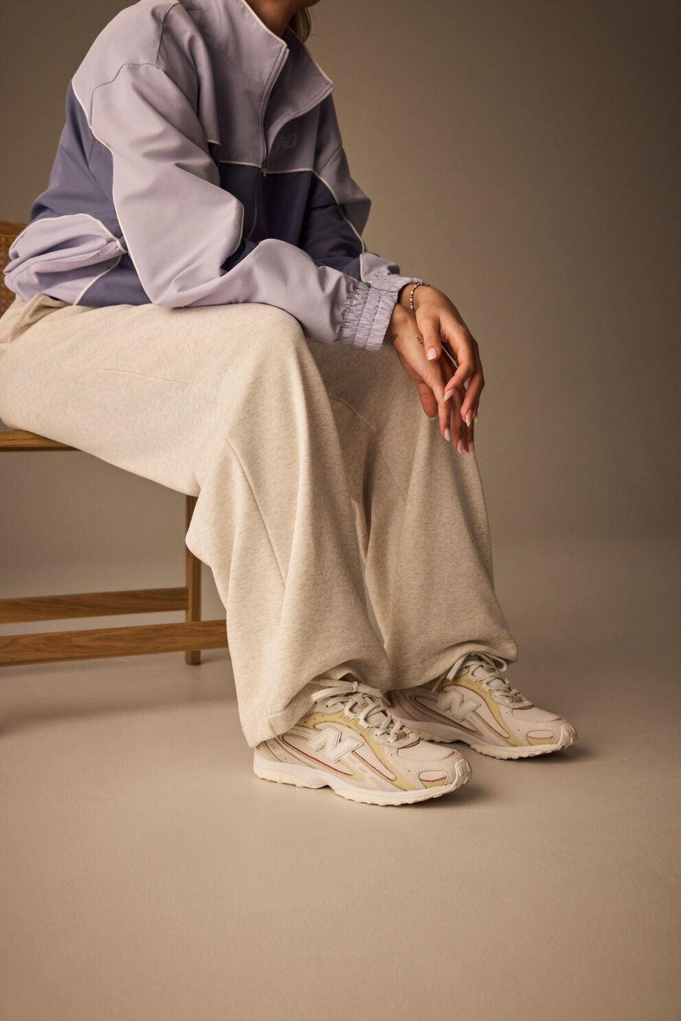 Close up of person wearing New Balance 204L sneakers 